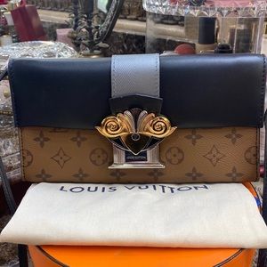 Louis Vuitton column clutch bag with strap could be used as crossbody or clutch